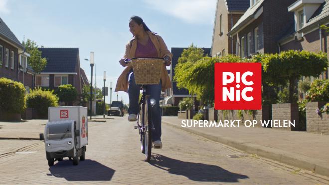 An advertisement for picnic which has the words "Supermarkt on wheels" written in dutch