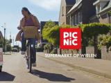 An advertisement for picnic which has the words "Supermarkt on wheels" written in dutch